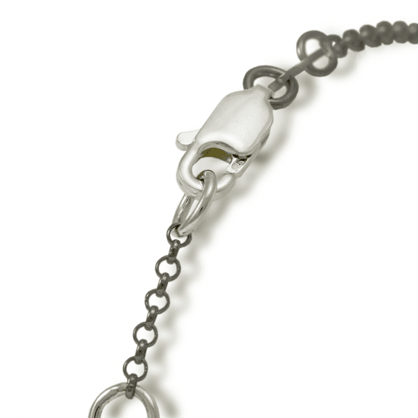 Close up of silver clasp for bracelet