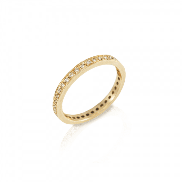 The Odine Full Eternity Ring is handmade in yellow gold and 37 white diamonds