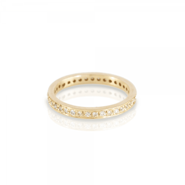 The Odine Full Eternity Ring is handmade in yellow gold and 37 white diamonds